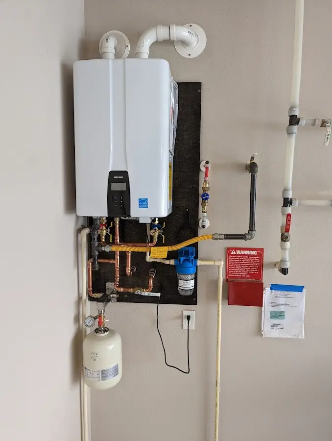 Professional plumber installing copper piping in a Nags Head home