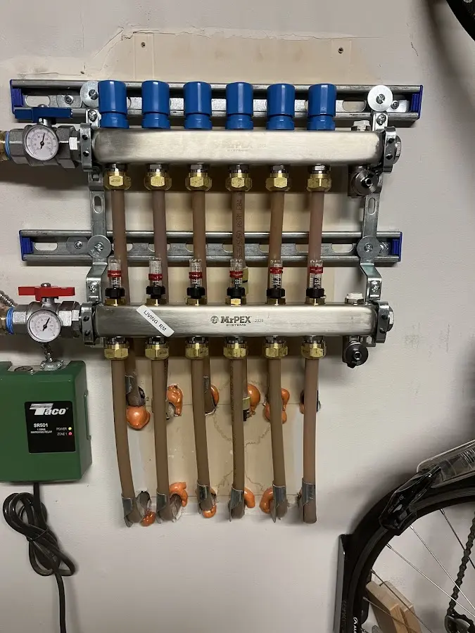 Plumber performing Water Heater Repair at a residential property in Nags Head